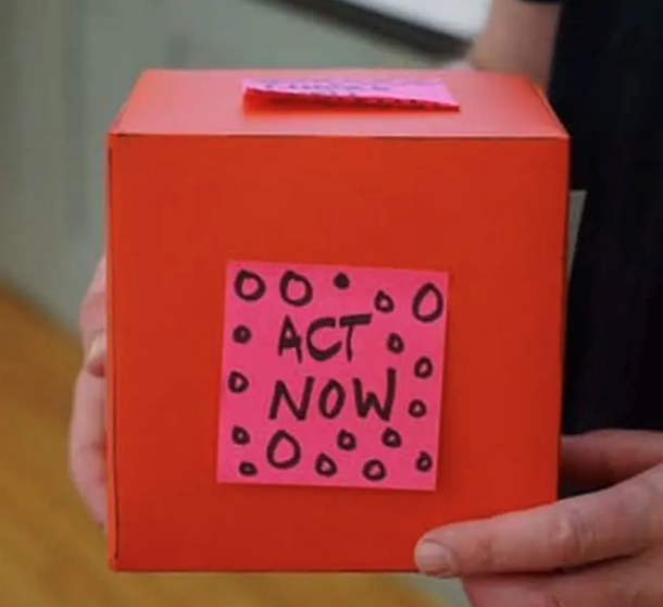 Act Now written on a box